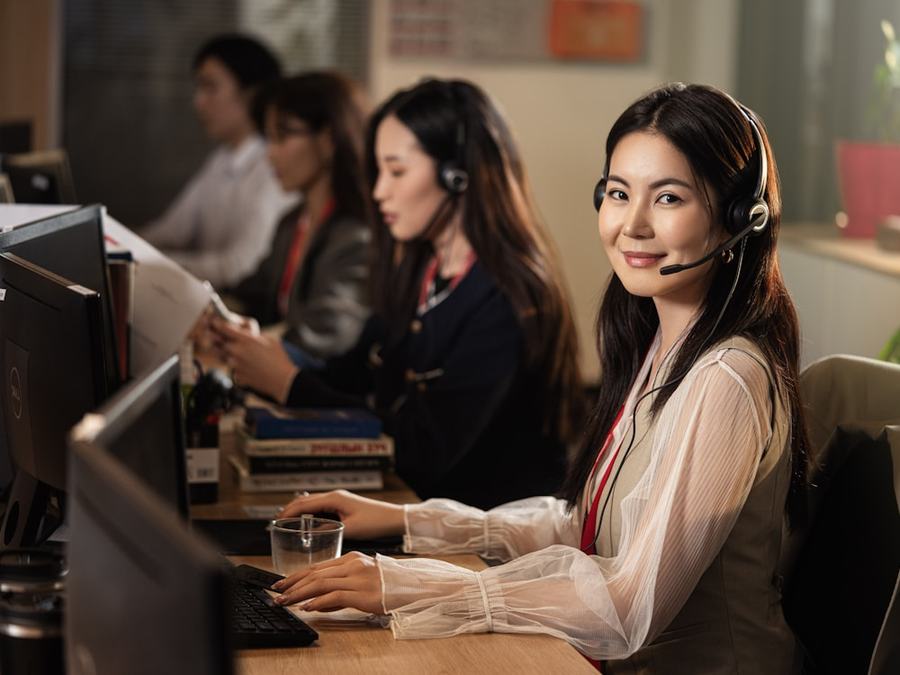 Contact centre agent wearing a headset, taking a customer call
